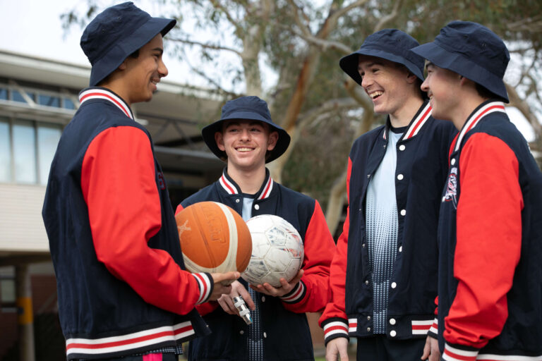 Four secondary school boys with sun safe hats and clothing.